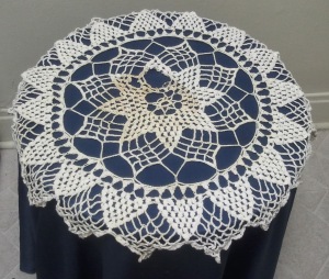 My First Doily. The discoloration and hole are from water damage from having it under a plant for a few years.